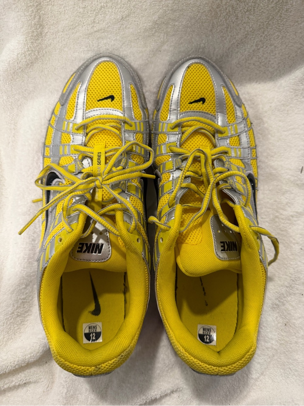 Nike p-6000 size 12 men’sYellow & Silver Running Sneakers